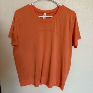Lululemon Swiftly T-shirt Orange Excellent condition, still has rip tag! Sz 12